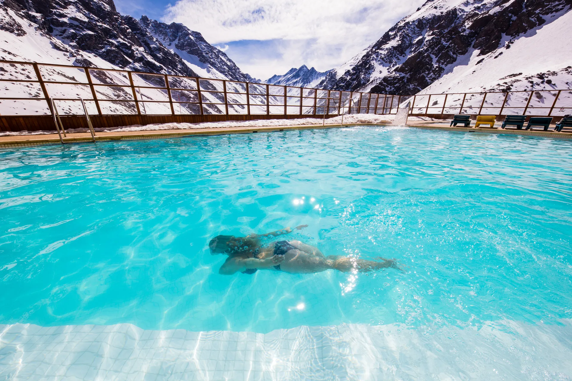 Swimmer in mountain pool